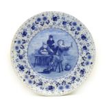 A large Dutch Delft blue and white charger,