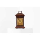 A beech and gilt-metal musical clock,