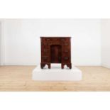 A George II walnut and feather-banded kneehole desk,