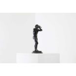 A patinated bronze figure of a faun,