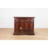 A panelled walnut credenza,