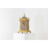 A late Victorian brass and enamel mantel clock,