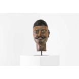 A carved wood and painted mask,