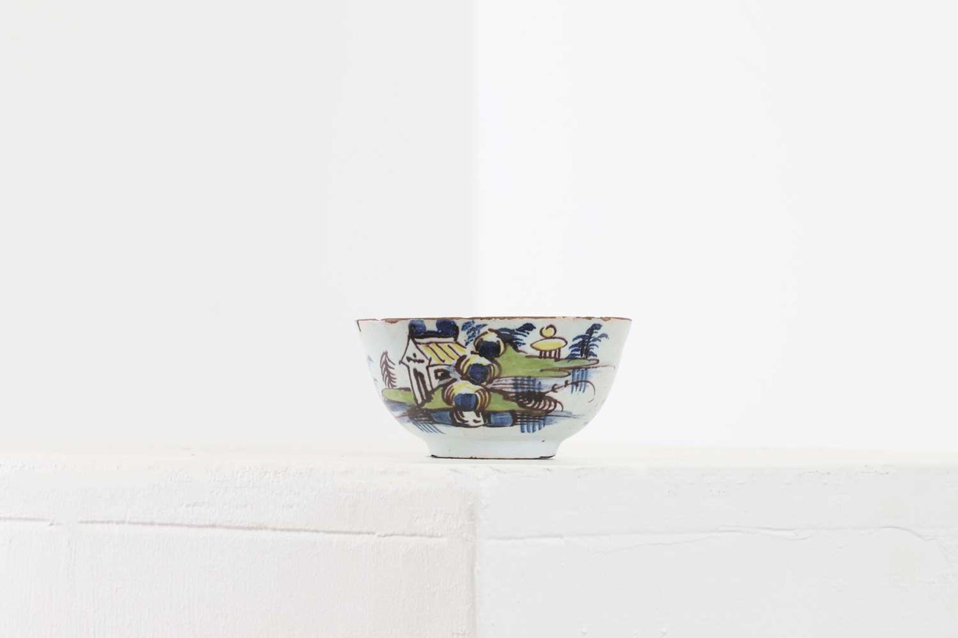 A small delft tin-glazed bowl,