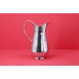 A silver water jug,