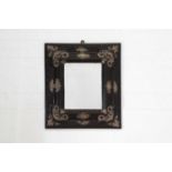 An ebonised fruitwood mirror,