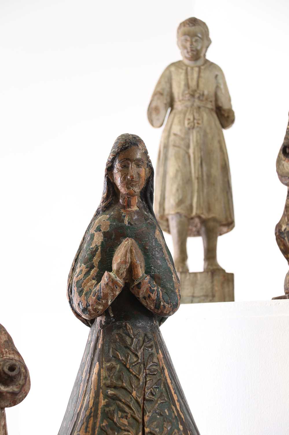 A group of carved and polychrome-painted wooden saints, - Image 3 of 17