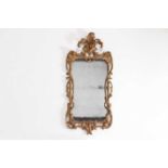 A George II carved giltwood pier glass,