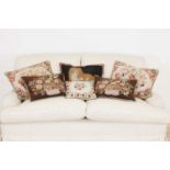 A group of six needlepoint cushions,