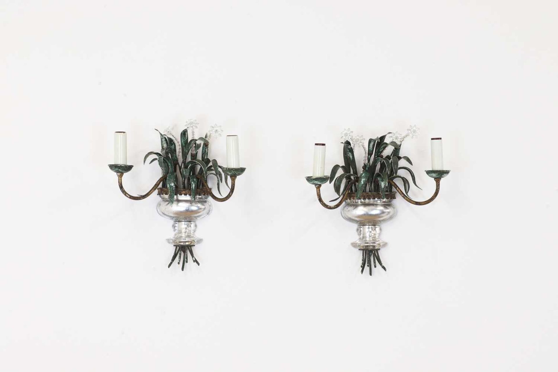 A pair of glass and metal wall lights,