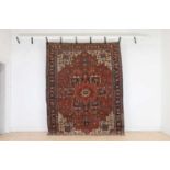 A Persian Heriz wool rug,