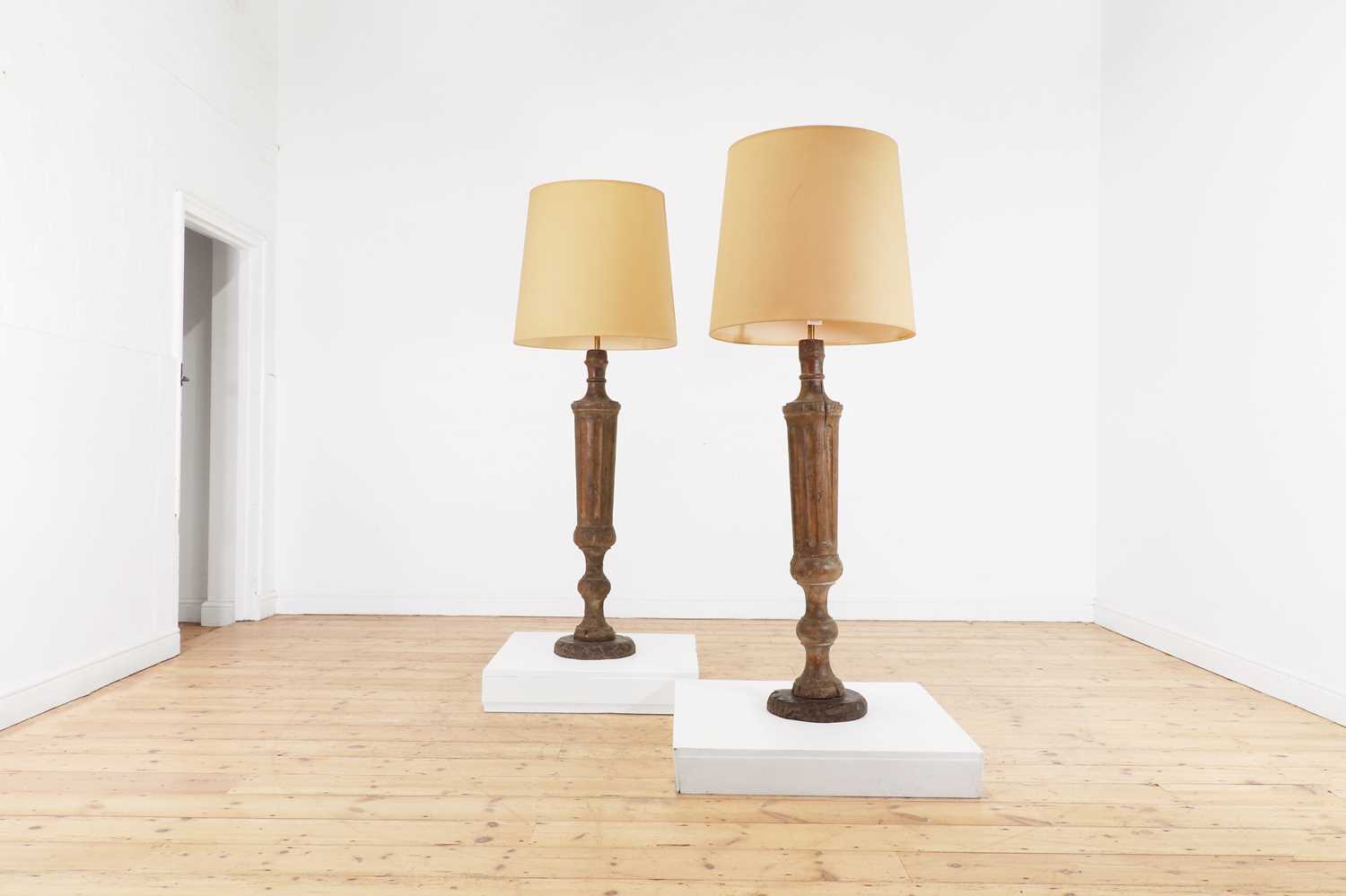 A pair of painted wooden pilaster floor lamps,