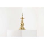 A polished brass pricket candlestick,