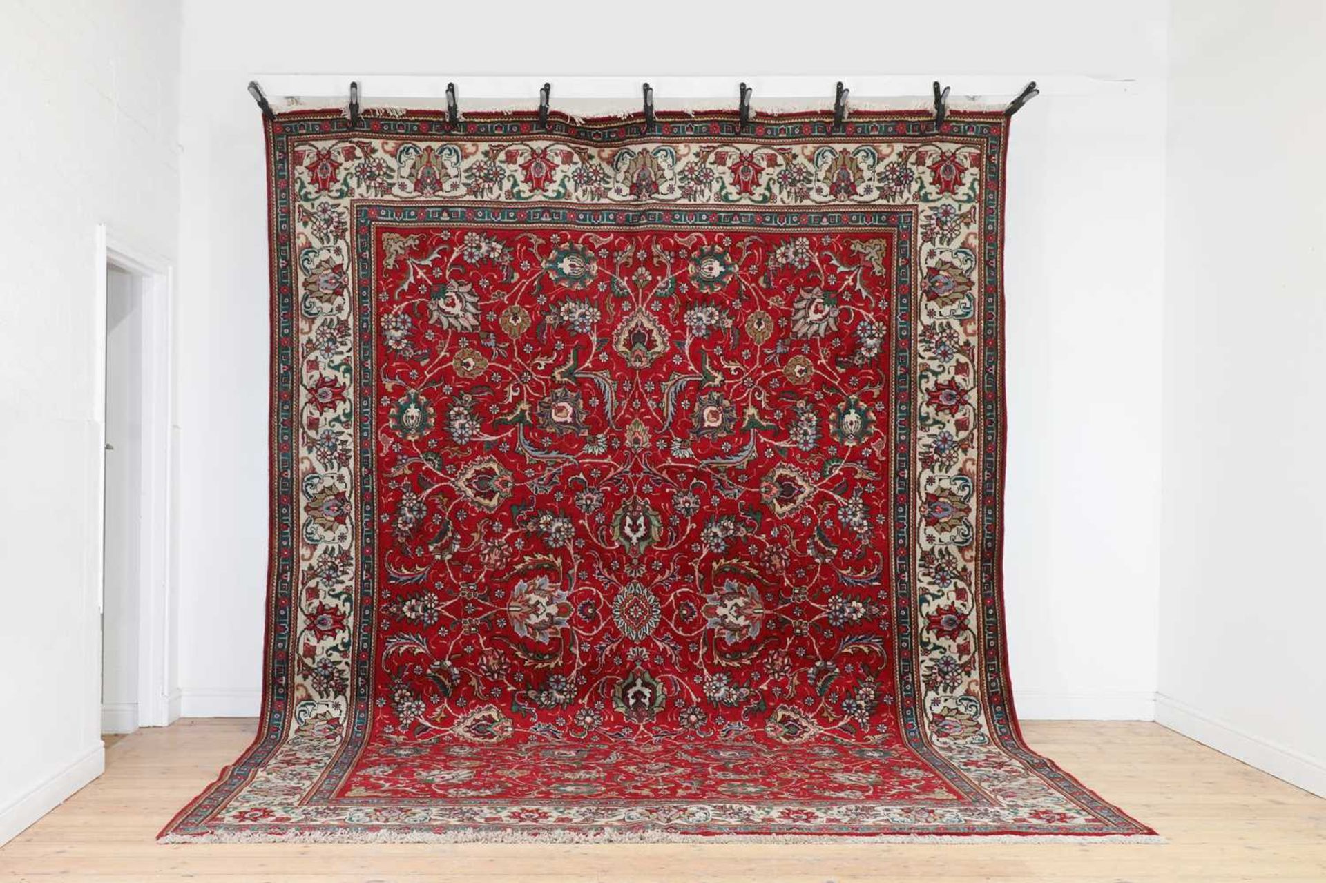 A Persian wool carpet,