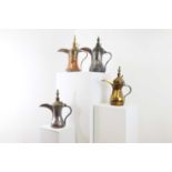 A group of four large 'dallah' coffee pots,