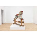 A painted wooden rocking horse,