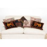 A group of seven cushions,