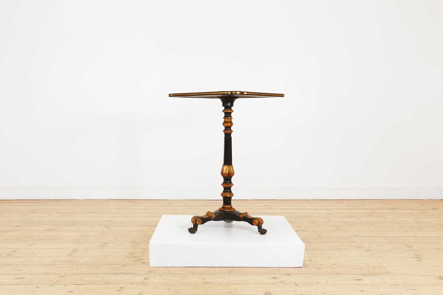 An ebonised and parcel-gilt occasional table,