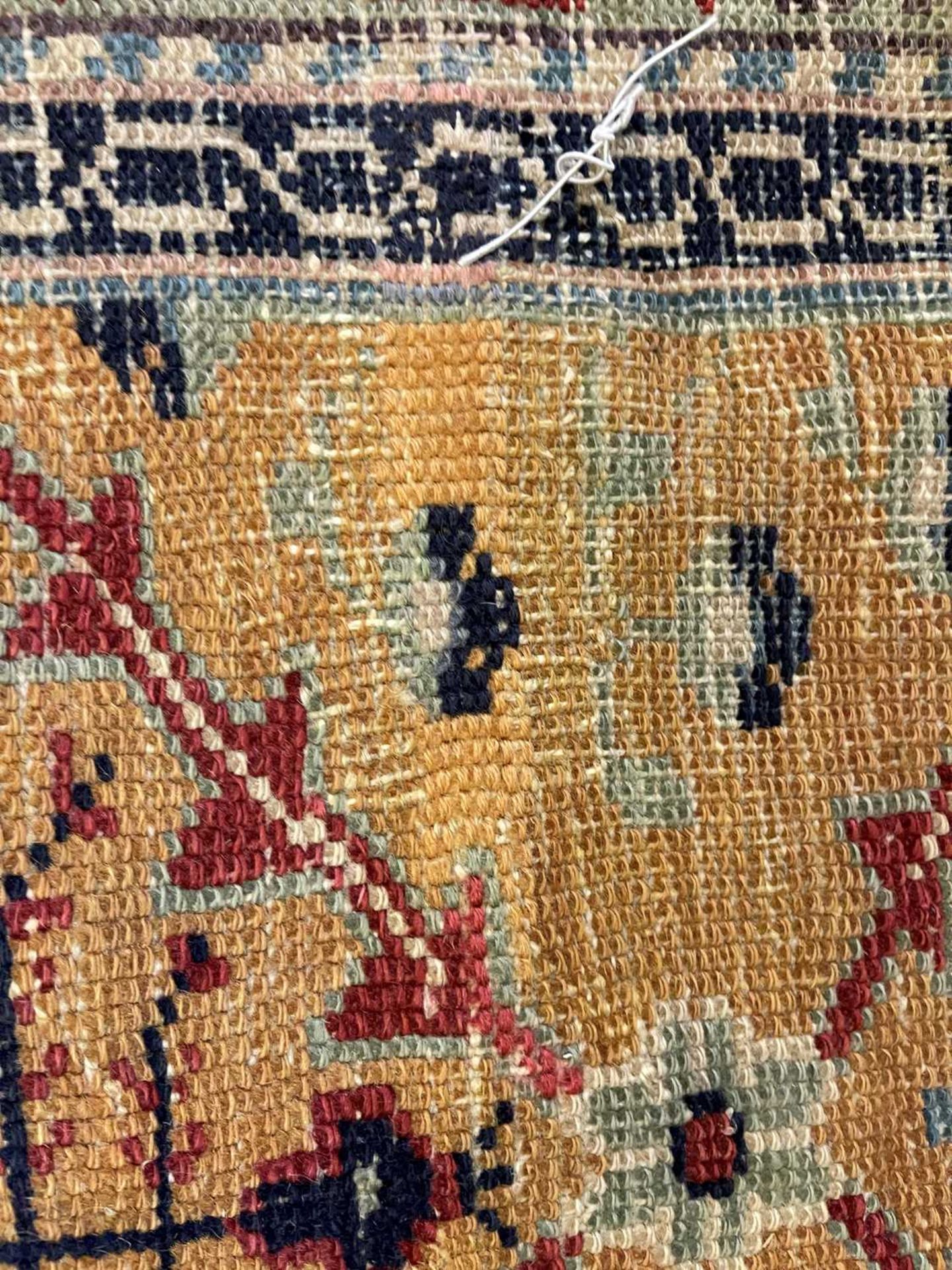 A Persian wool carpet, - Bild 25 aus 26