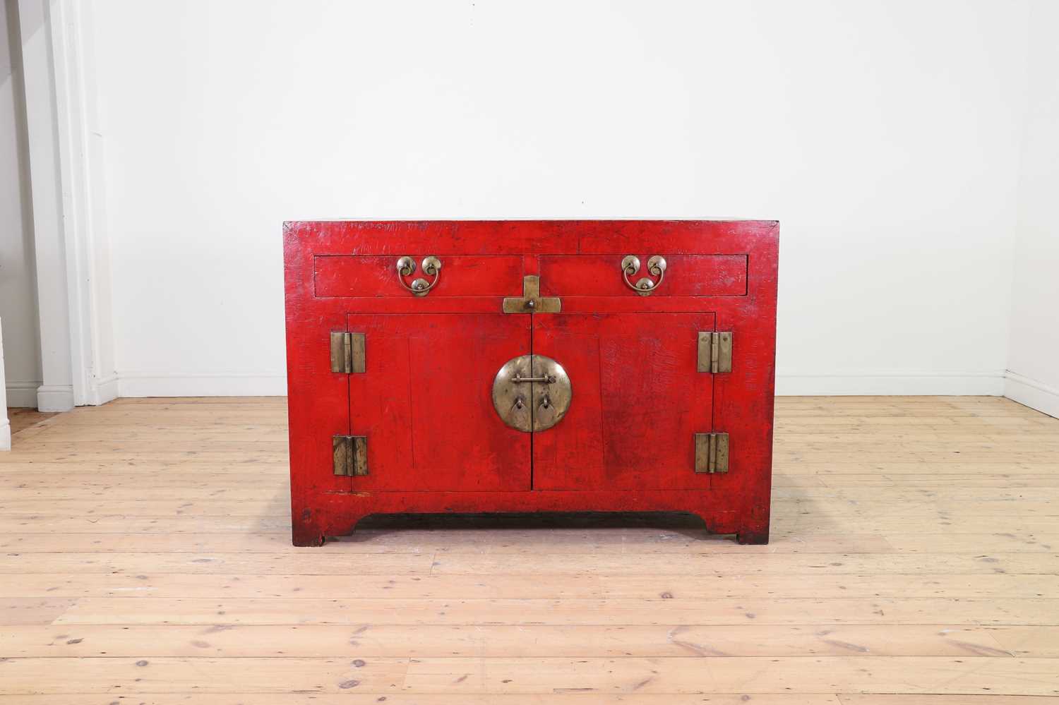 A red-lacquered elm side cabinet,