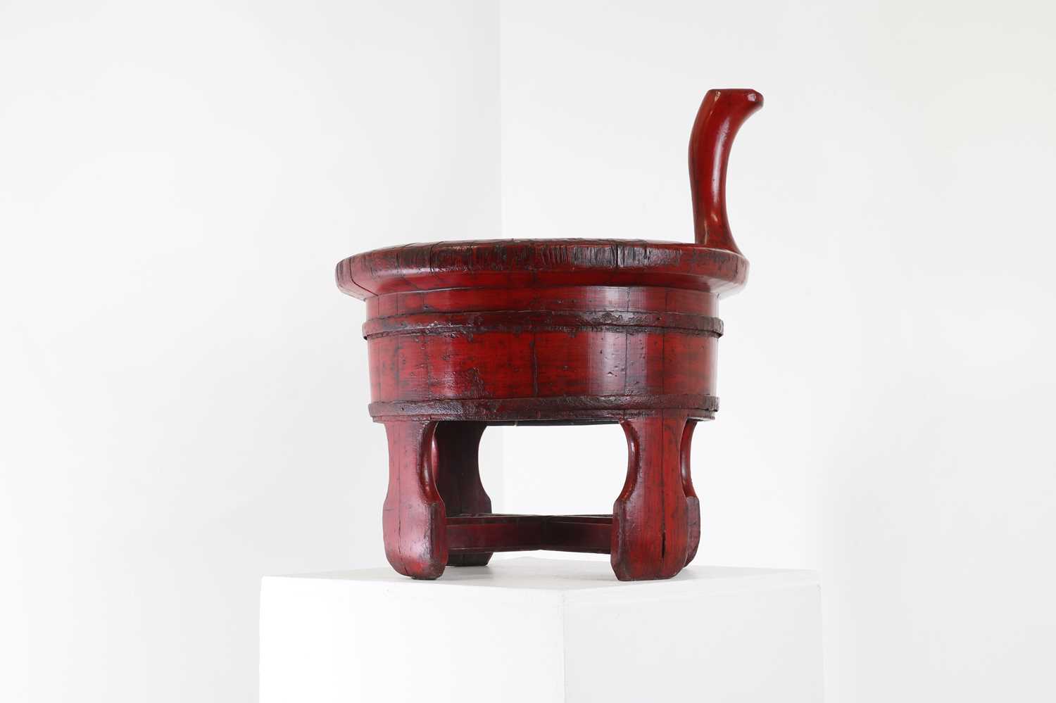 A red-lacquered baby bath,