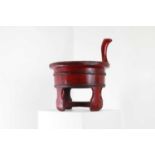 A red-lacquered baby bath,