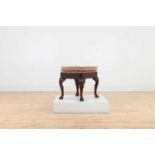 A George I walnut stool,