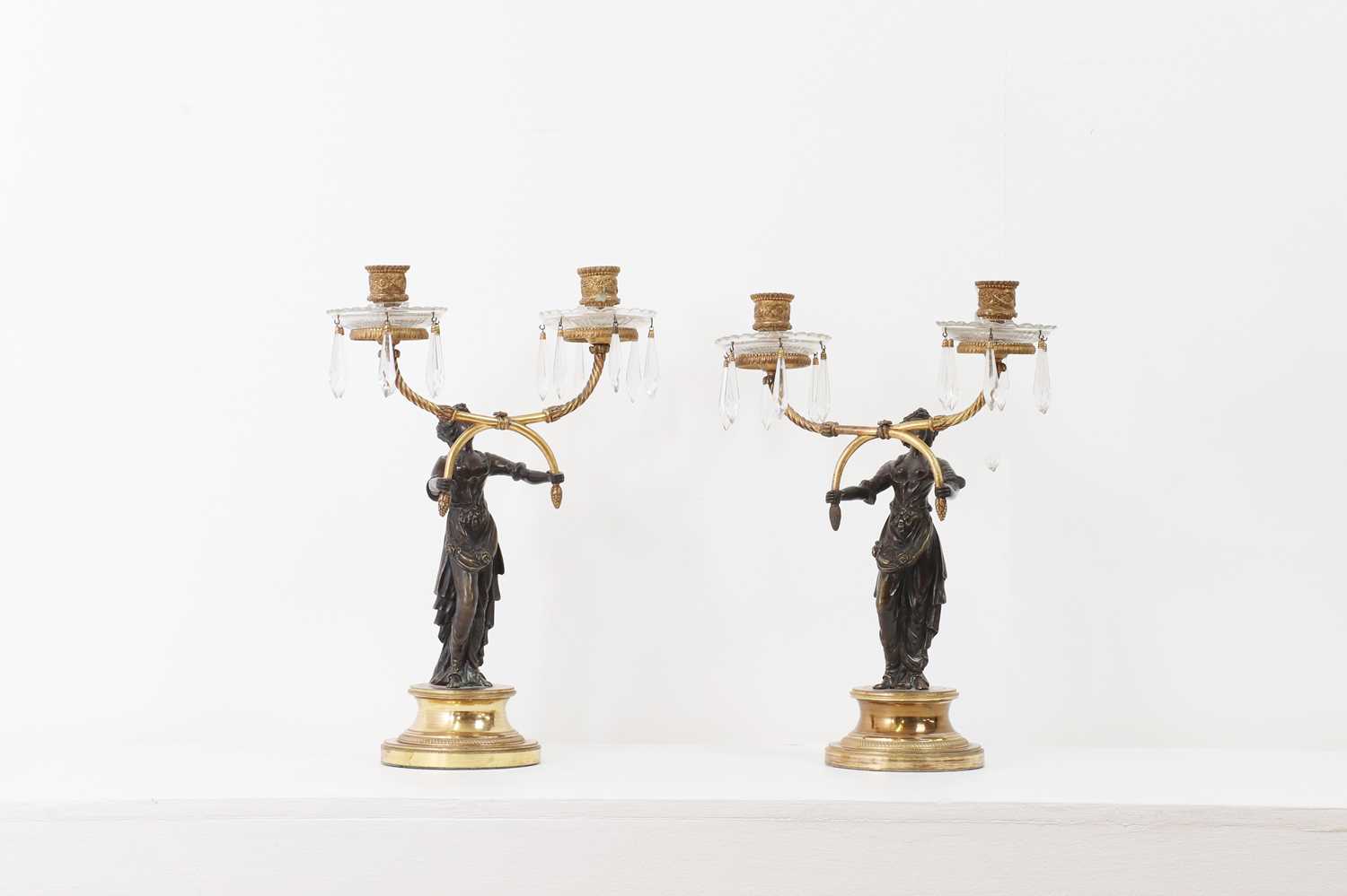 A pair of Empire-style gilt and patinated bronze candelabra,