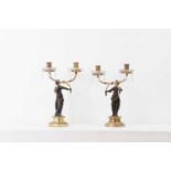 A pair of Empire-style gilt and patinated bronze candelabra,