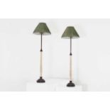 A pair of faux marble and embossed metal table lamps,