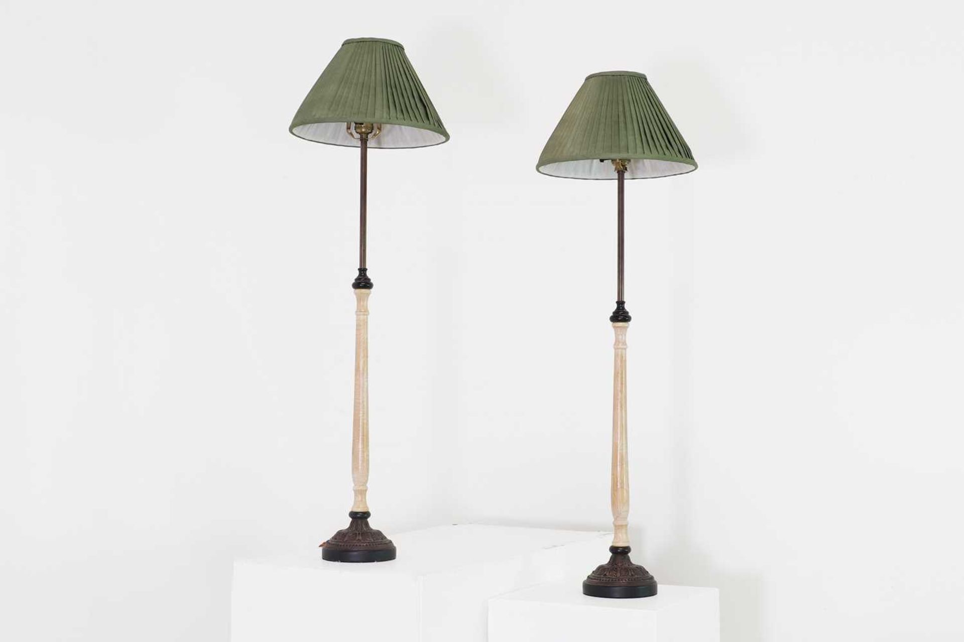 A pair of faux marble and embossed metal table lamps,