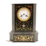 A brass inlaid ebonised mantel clock