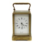 An engraved brass carriage clock