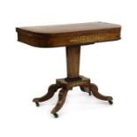 A Regency rosewood and brass inlaid card table