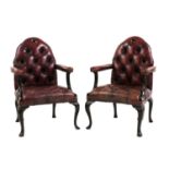 A pair of mahogany Gothic Revival-style leather armchairs