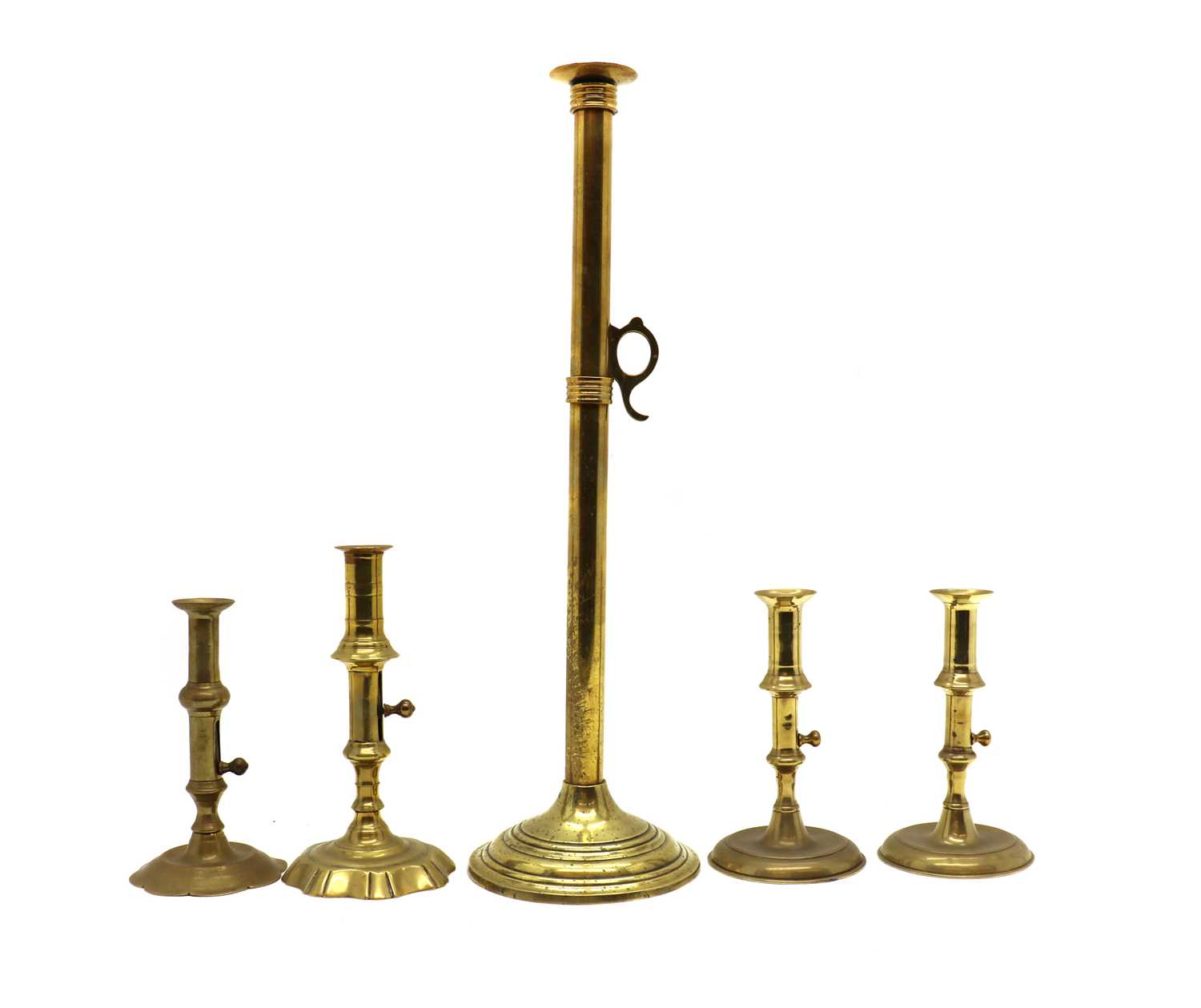 A tall brass candlestick,