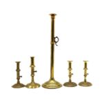 A tall brass candlestick,