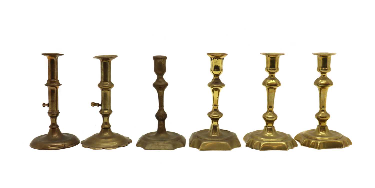 Six Georgian brass candlesticks,