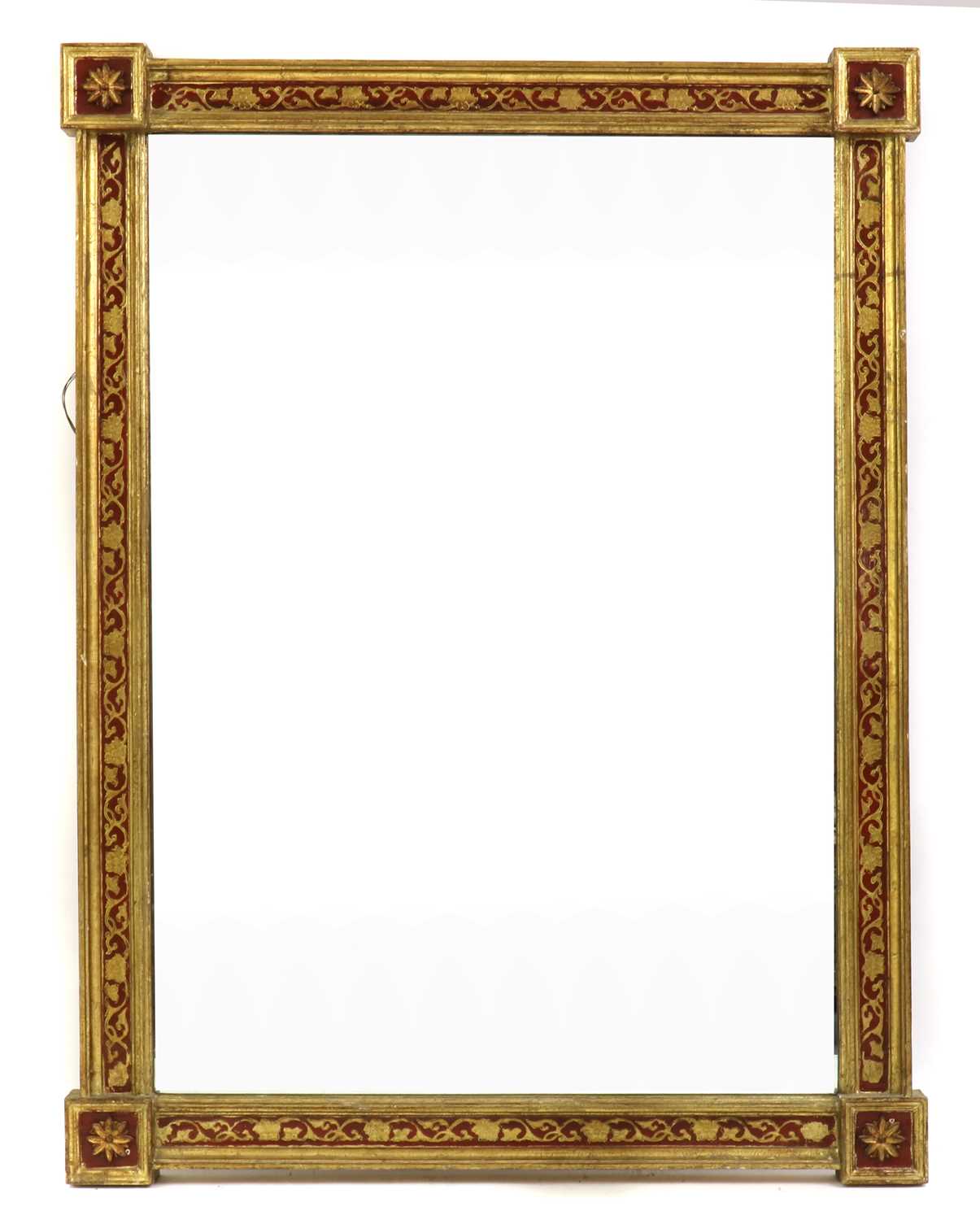 A painted and parcel gilt wall mirror