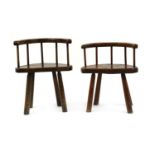 A near pair of oak stick back chairs