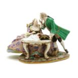 A Meissen porcelain figure of a man and a lady,