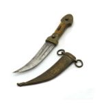 A small Middle Eastern brass dagger in scabbard,