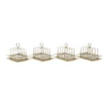 A set of four Victorian silver five-bar toast racks,