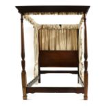 A mahogany four poster bed