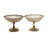 A pair of silver bon bon dishes