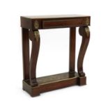A Regency rosewood and brass inlaid console table