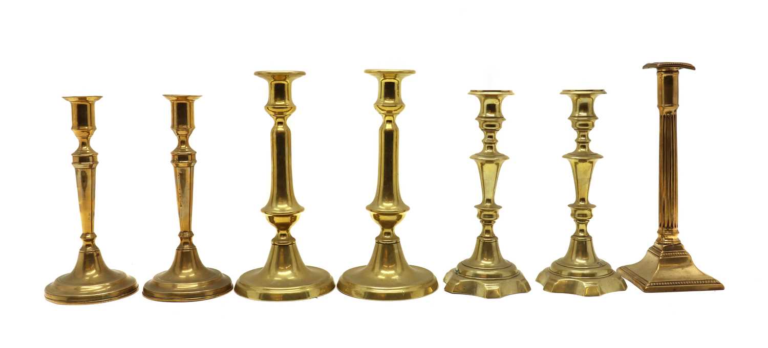 Three pairs of brass candlesticks,