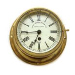 A brass bulkhead clock