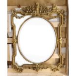 A large and ornate gilt gesso wall mirror