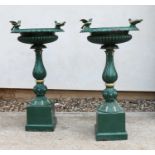 A pair of English cast iron bird baths,